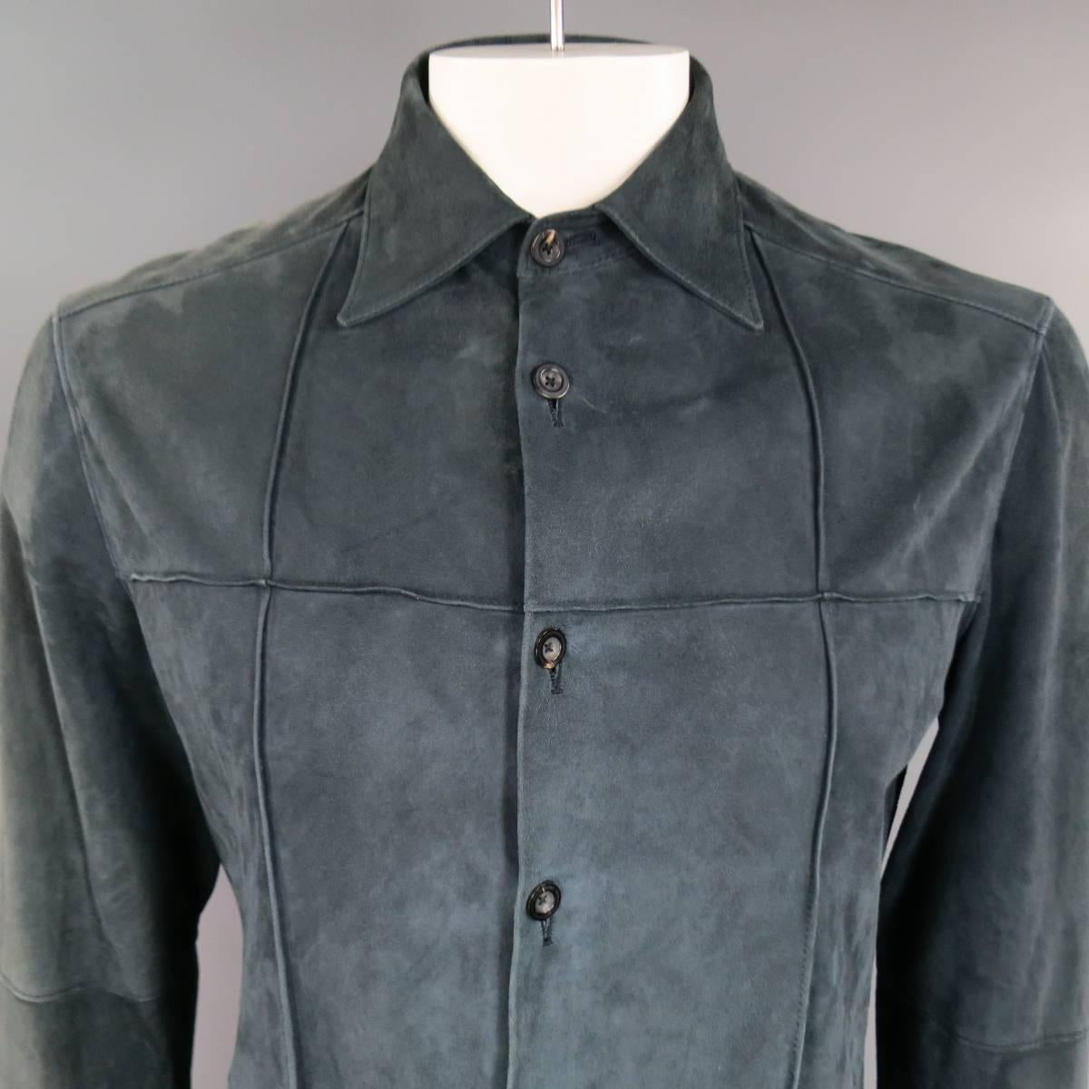 This vintage JIL SANDER shirt comes n a deep navy teal suede with all over grid windowpane seams with a pointed collar and button up  front. Natural wear throughout suede and discolorations on left side shown in detail shots. (AS-IS) Made in