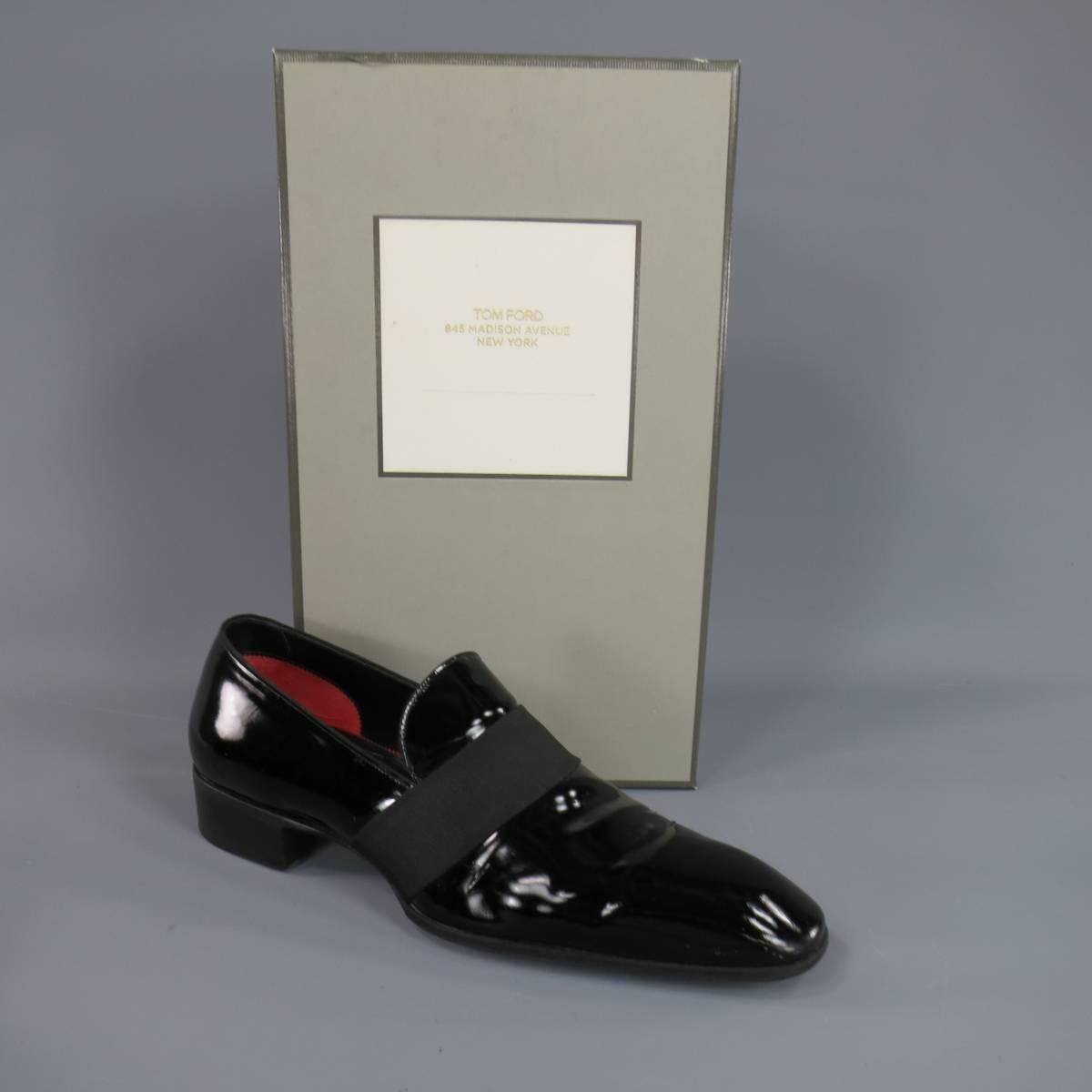 These chic Men's TOM FORD tuxedo loafers come in high gloss black patent leather with a squared pointed toe ribbon band and 1.25 inch heel. With Box. Made in Italy.

Retails at $1440.00.

Excellent Pre-Owned Condition.
Marked: Size 8 EE fits