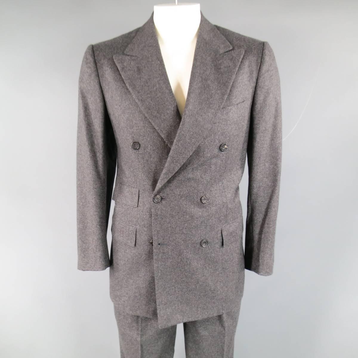 Classic men's KITON for WILKES BASHFORD two piece suit in charcoal Heather gray cashmere including a double breasted, notchlapel sport coat with triple flap pockets, and double vented back with matching pleated, cuffed hem trousers. Made in Italy.
