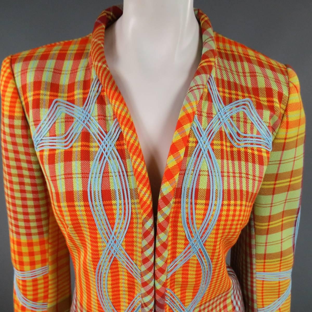 This fabulous CHRISTIAN LACROIX jacket comes in a bold, colorful plaid with hints of orange, yellow burgundy, mint and blue and features a a thick band collar, hook eye closures, and symmetrical blue pattern applique. Made in France.
 
Excellent