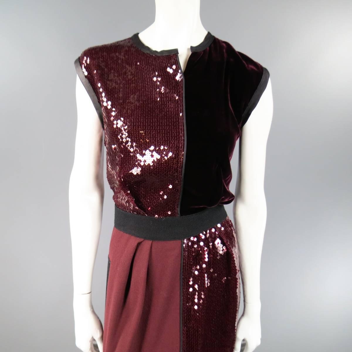This fabulous MARC JACOBS cocktail dress features patchwork panels of burgundy sequin, velvet, and crepe with black leather trim, woven belt panel, and slit neckline. Made in USA.
 
Excellent Pre-Owned Condition.
Marked: US 4
 
Measurements:
