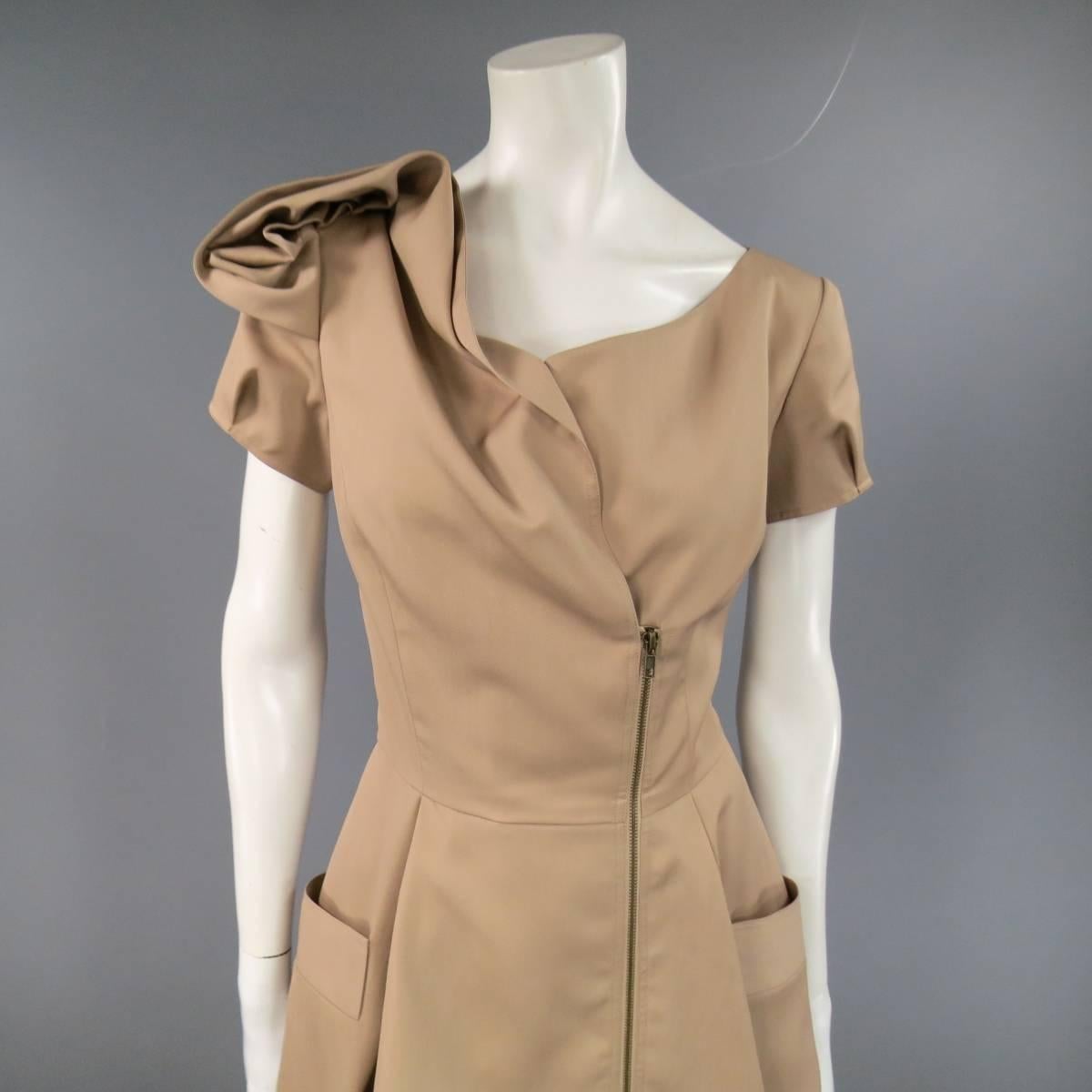 This fabulous OSCAR DE LA RENTA cocktail dress comes in a camel beige wool silk blend twill and features an asymmetrical zip closure, curved neckline, pleated short sleeves, a line pleated skirt, and gorgeous shoulder embellishment. Made in USA.
