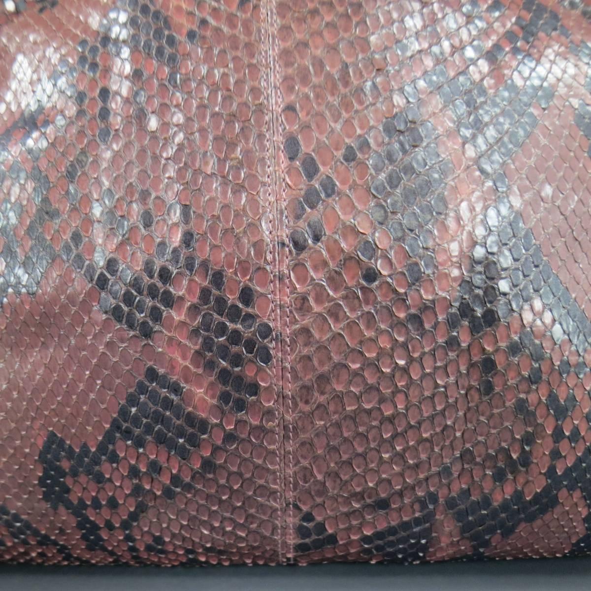 This fabulous vintage GIANNI VERSACE handbag comes in light pink metallic pearl python skin leather and features a gathered top with gold hardware, light champagnt gold knotted handle, expandable sides, and internal matching storage pouch. Made in