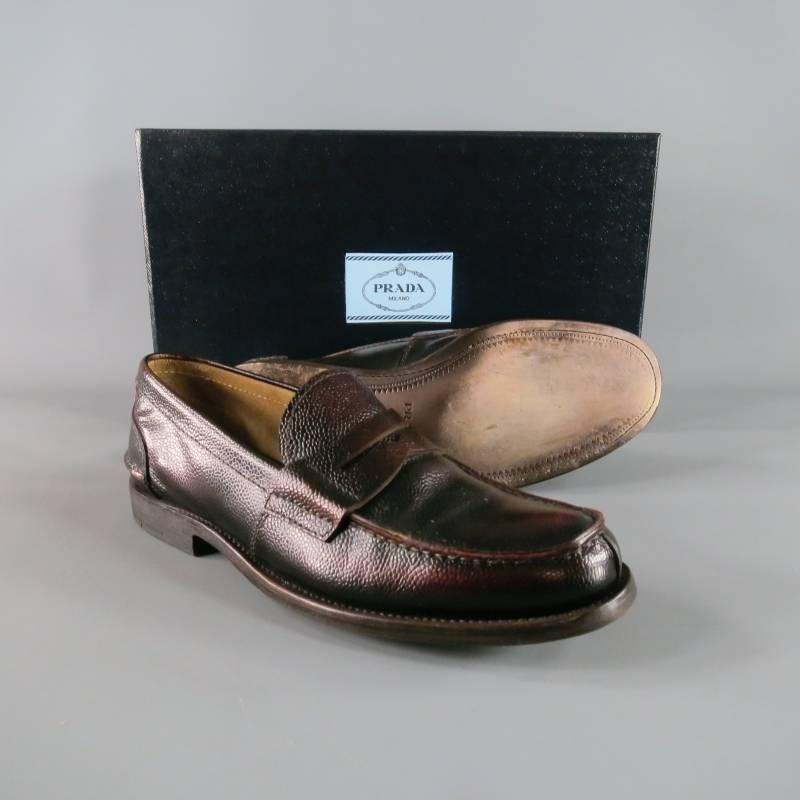 Classy PRADA slip on loafer in bison leather; pebbled texture in brown tone with a subtly distressed polish style.  Vertical front seam with horizontal back heel seam with tone on tone stitching. Comfortable suede interior.  Wooden stack toe with