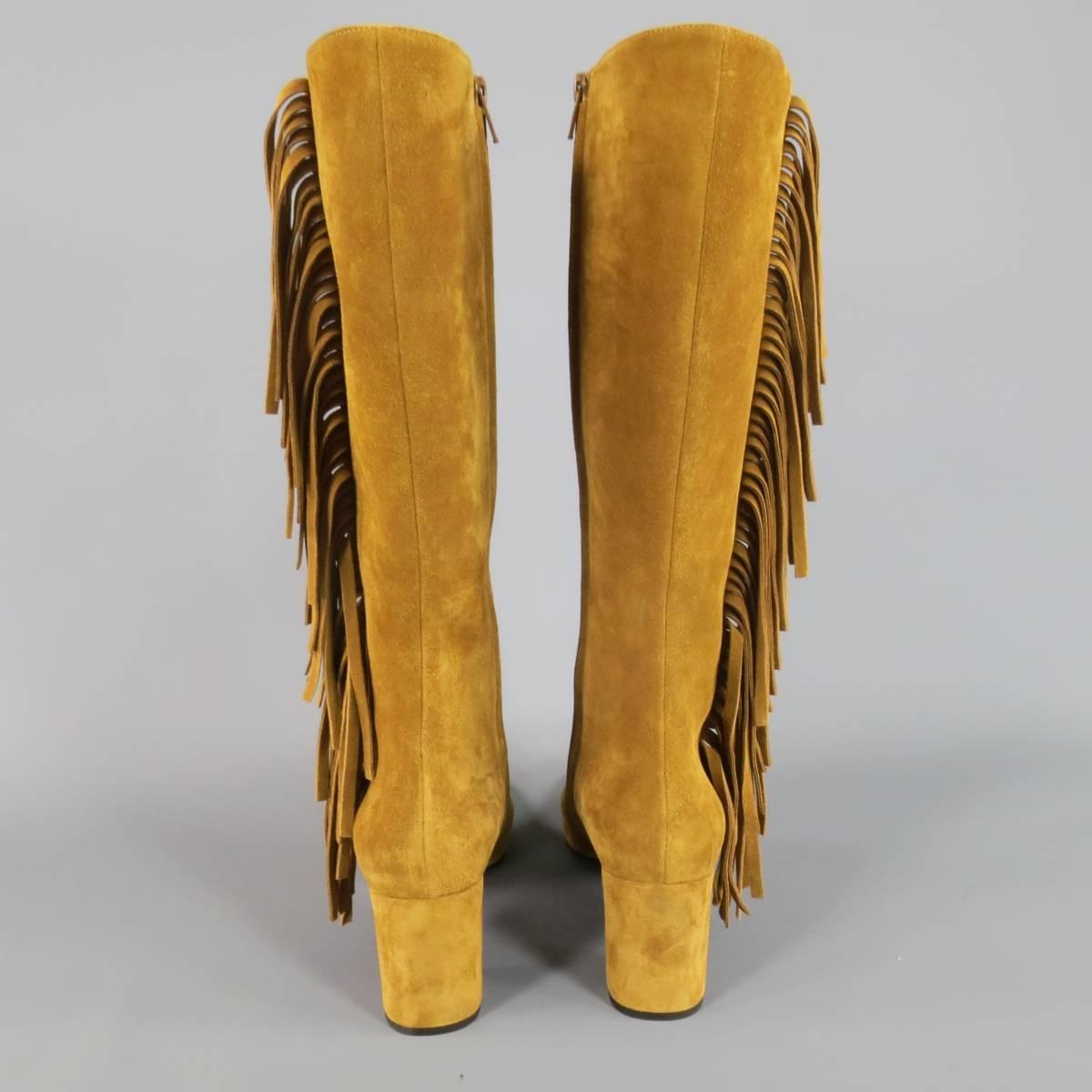 Fabulous SAINT LAURENT by Hedi Slimane knee high boots in soft tan suede featuring a chunky covered heel, internal zip closure, and fringe side. Made in Italy.
 
Excellent Pre-Owned Condition.
Marked: IT 38.5
 
Heel: 3 in.
Height: 14 in.