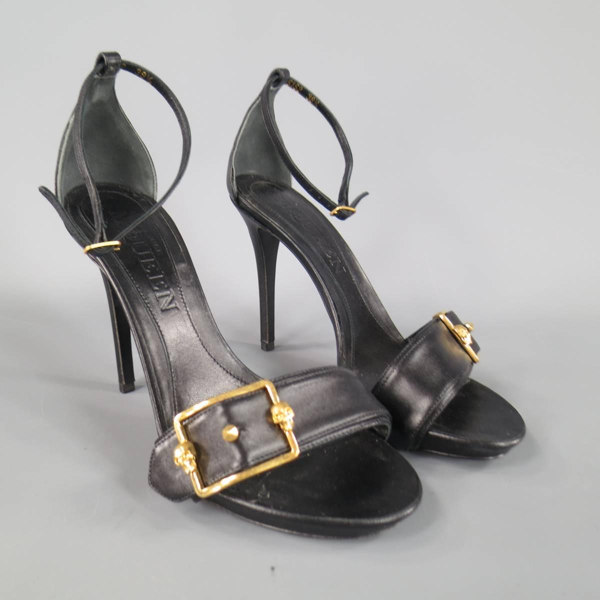 These fabulous ALEXANDER MCQUEEN sandals come in smooth black leather and feature a small platform, covered stiletto heel, skinny ankle strap, and thick belt toe strap with gold tone skull buckle. Made in Italy.
 
Excellent Pre-Owned
