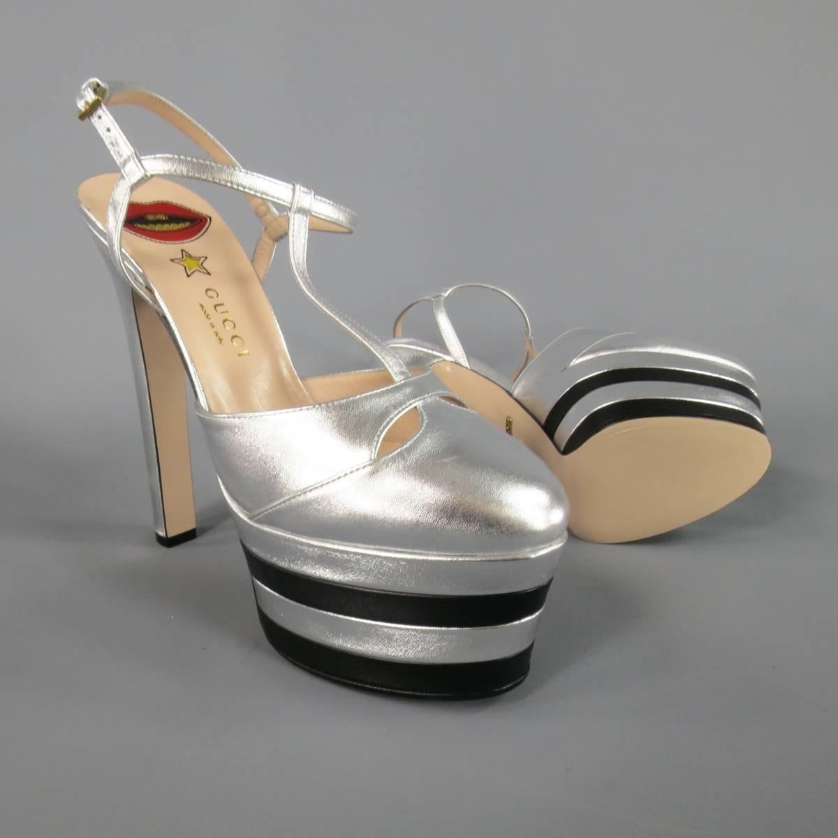 These fabulous GUCCI platforms come in light metallic silver leather and feature a rounded point toe with cutouts, T strap ankle harness, covered thick stiletto heel, and striped platform. Made in Italy.
 
Brand New Condition.
Marked: IT 38.5
