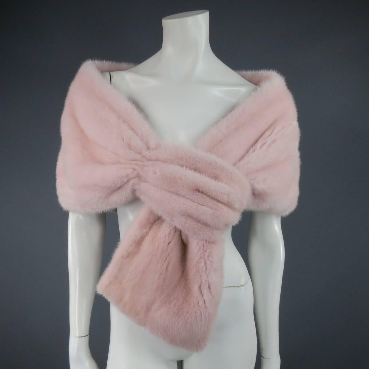 Fabulous MONIQUE LHUILLIER wrap stole in dusty rose pink soft mink fur with gathered loop end and silk lining. Made in USA.
 
Excellent Pre-Owned Condition.
 
Measurements:
 
Length: 58 in.
Width: 14 in.
End Width: 9 in.