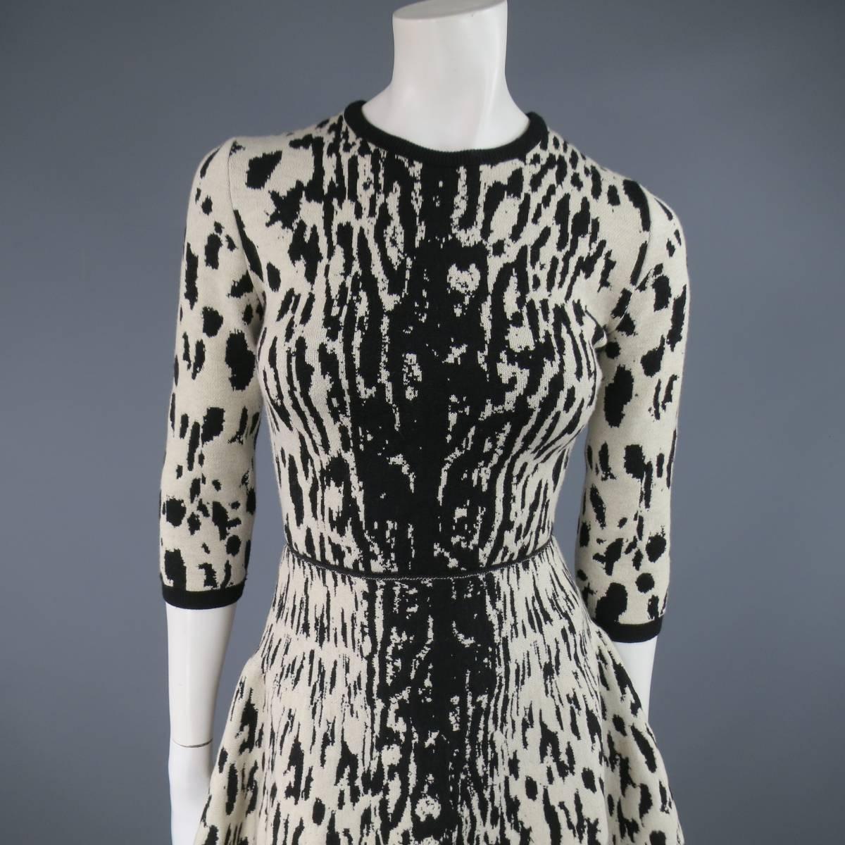 This chic LANVIN Fall 2013 dress comes in a heavy textures stretch wool and features a beige and black cheetah leopard print throughout, crewneck, 3/4 sleeves, fitted waist, and flared skirt. Made in Italy.
 
Excellent Pre-Owned Condition.
No