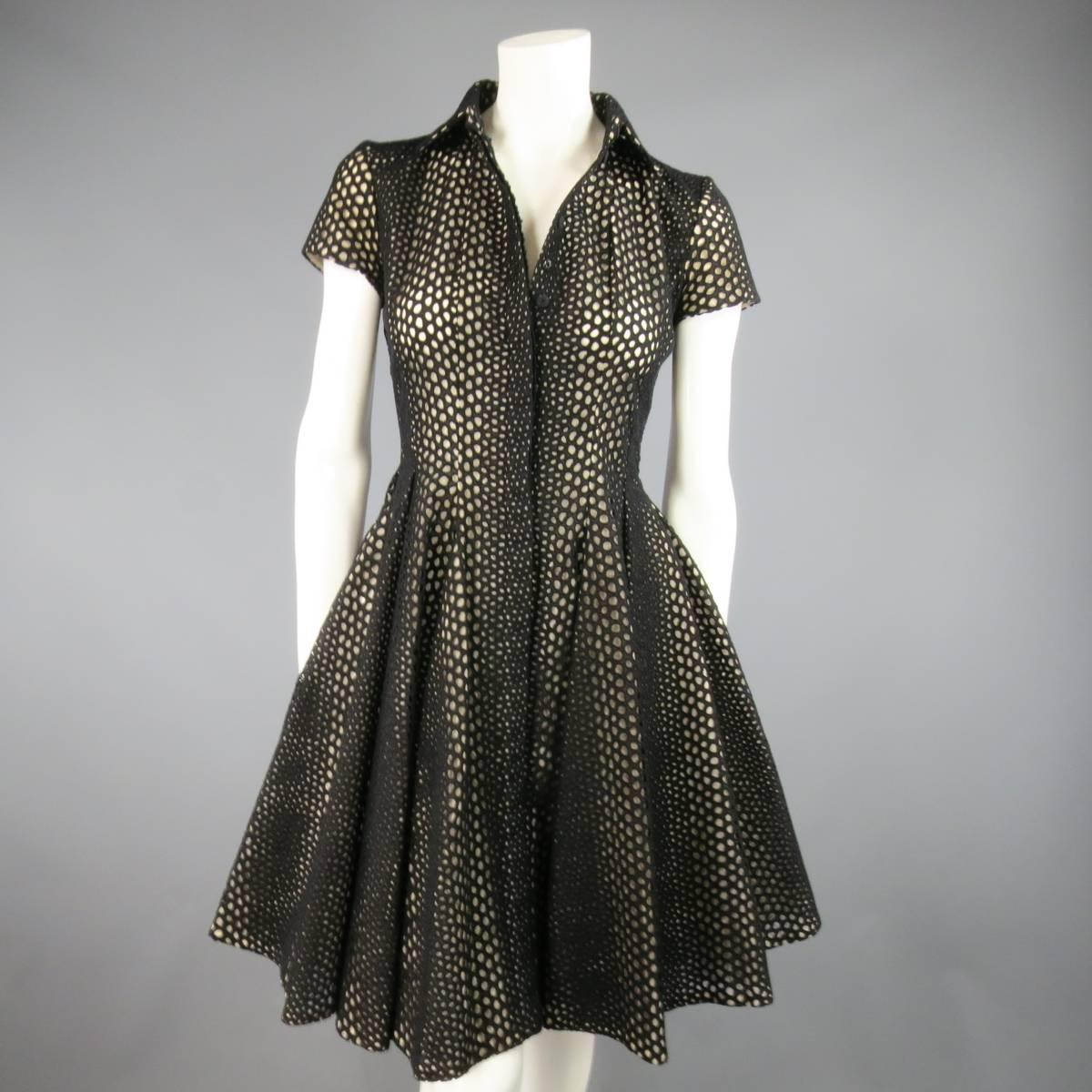 This gorgeous Giambattista Valli shirt dress comes in a black eyelet lace with peachy beige underlay and features a pointed collar, short cap sleeves, hidden placket snap closure, and pleated ruffle flare skirt. Made in Italy.
Retails at $2795.00.
