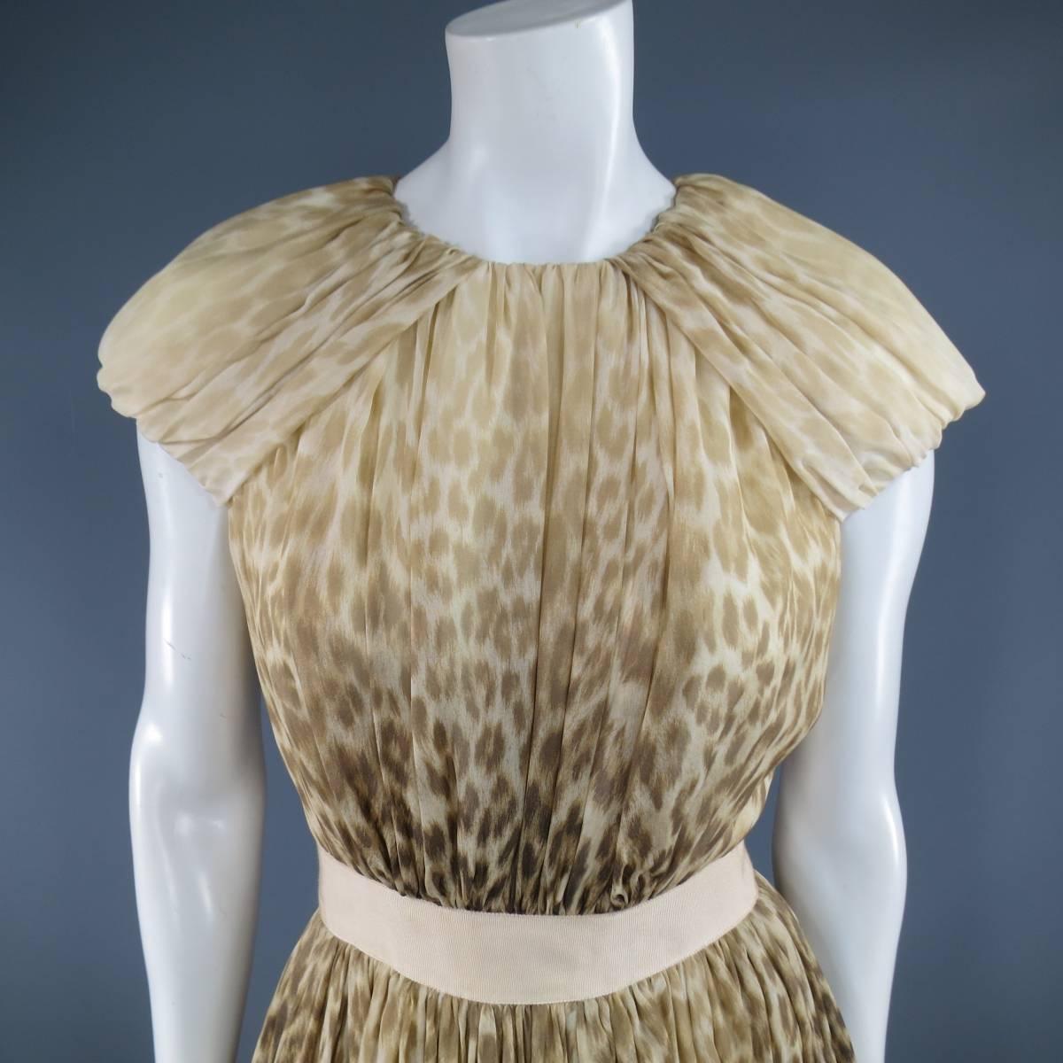 This stunning Giambattista Valli Couture cocktail dress comes in a beige and brown gradient ombre leopard cheetah stretch silk chiffon and features a gathered bodice, gathered shoulder panels, peachy beige ribbon waistband, and soft pleated A line