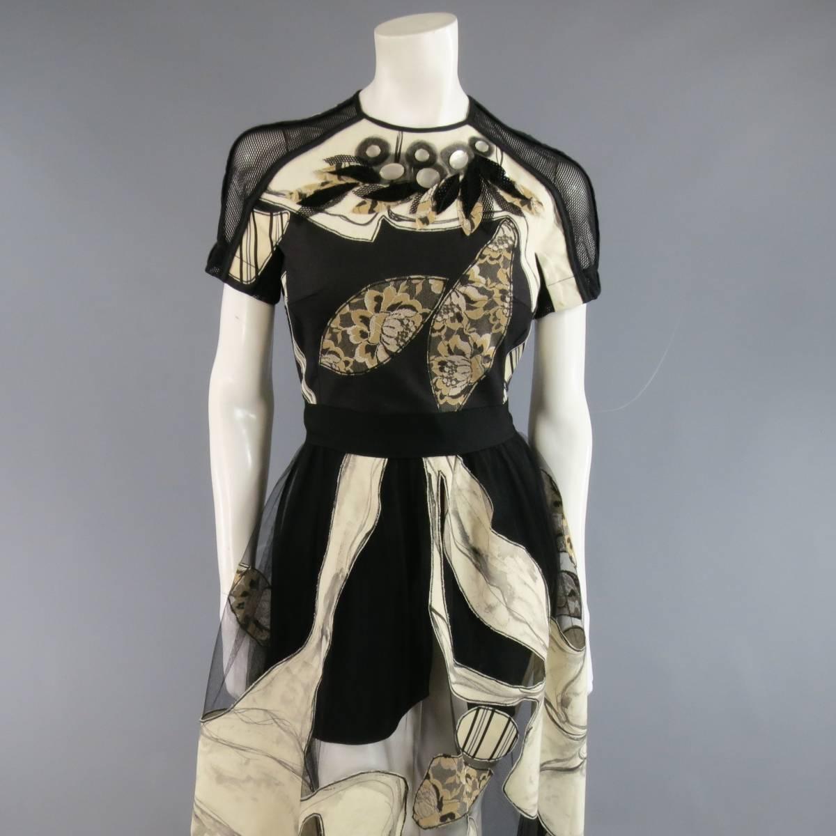 This stunning ANTONIO MARRAS evening gown features a crewneck short sleeved bodice featuring a black fabric front with hand painted beige panels, gold lace appliques, sequin leaves and mesh leaves, mesh arms with piping, and oversized beads with