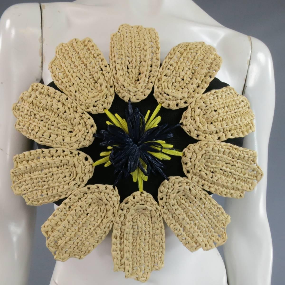 This fabulous DELPOZO bustier top comes in a structured black fabric and features an oversized beige straw flower with navy & yellow straw center. Made in Spain.
Retails at $1500.00.
 
Excellent Pre-Owned Condition.
Marked: US 4
