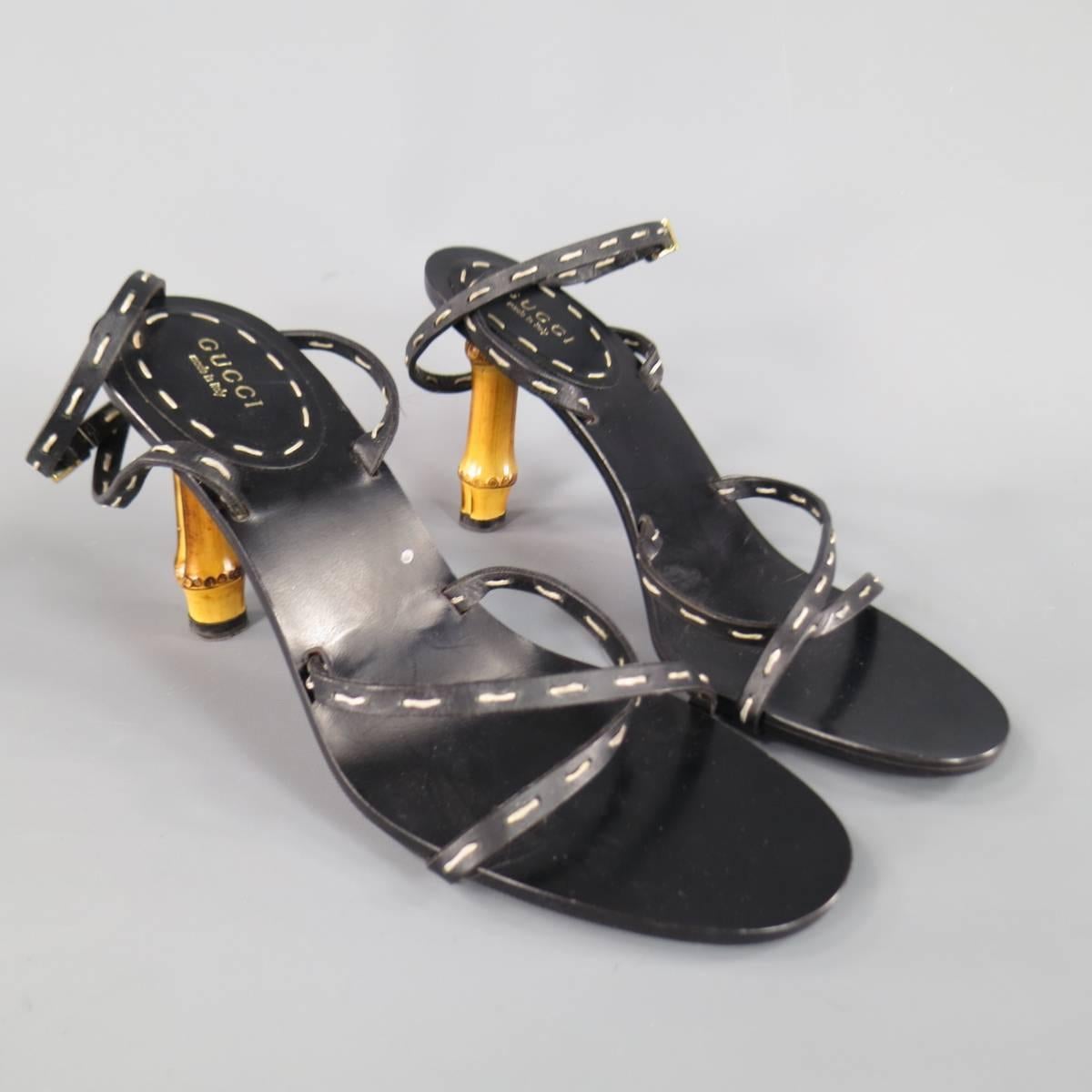 These fabulous GUCCI sandals feature thin black leather cross straps with contrast stitching and a thick bamboo heel. With Box. Made in Italy.
 
Excellent Pre-Owned Condition.
Marked: IT 38 C
 
Heel: 4 in.