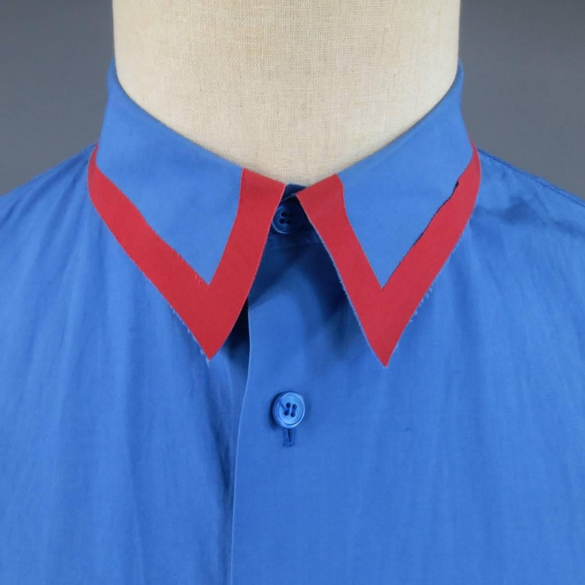 MARNI Long Sleeve Shirt consists of cotton material in a blue color tone. Designed with a button-up front, color blocked collar with outline in red tone and frayed edges. Detailed with single button cuffs and raw edges. Made in Portugal.
 
Good