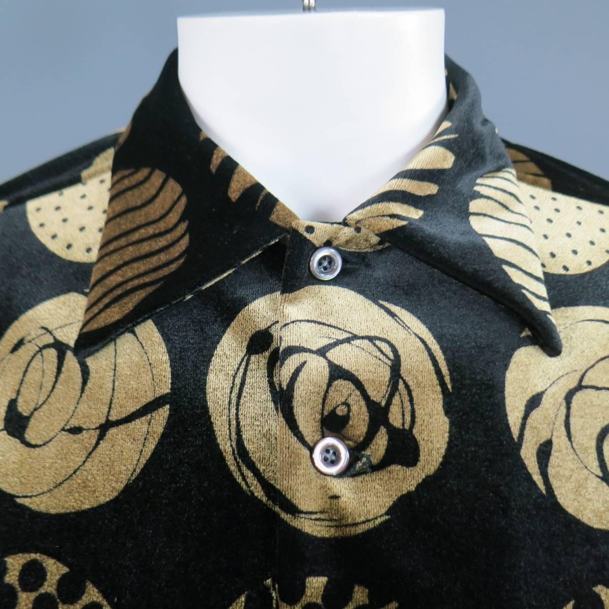 This rare vintage MATSUDA shirt comes in a black and metallic gold large scale printed polka dot velvet and features a pointed collar, patch breast pocket, and pearlescent buttons. Made in Japan.

Excellent Pre-Owned Condition.
Marked: