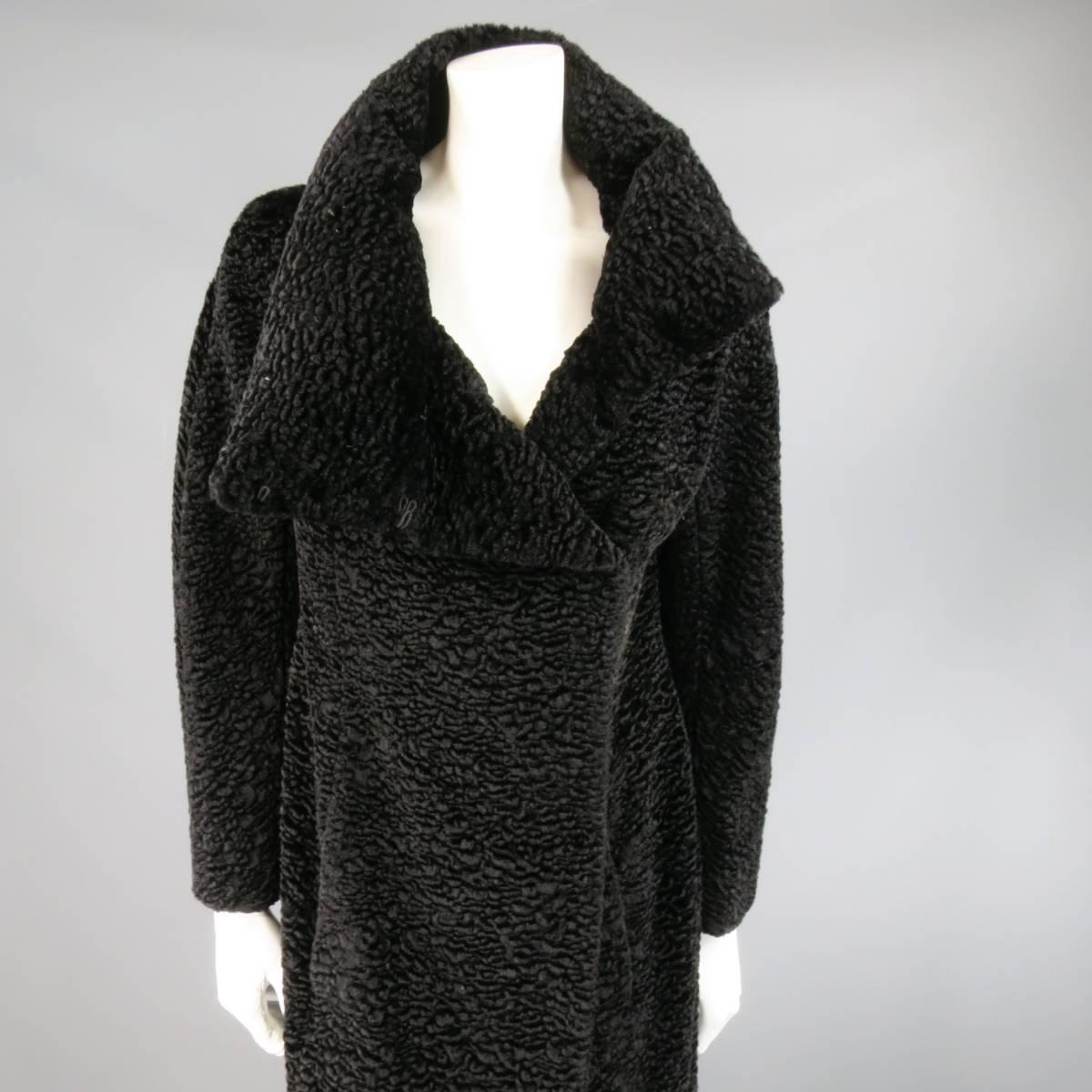 This stunning RICHARD TYLER COUTURE winter coat comes in a black cotton blend faux lamb fur textured fabric and features an A-line silhouette, asymmetrical hidden hook eye closure, slanted slit pockets, and round padded stand up collar. Mad in