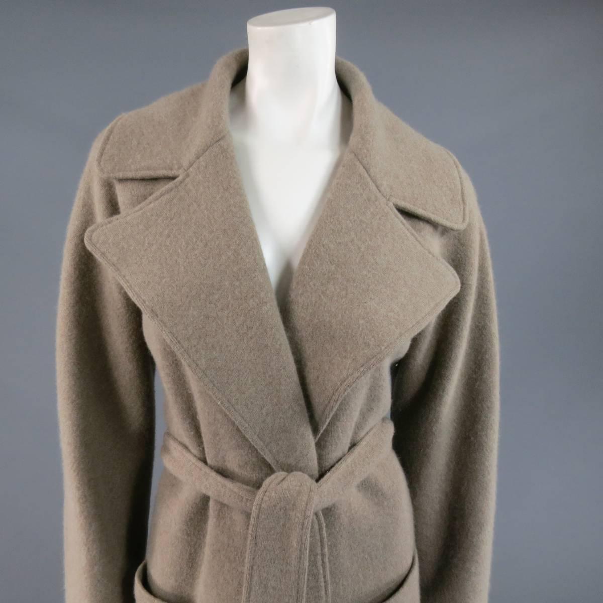 This lovely RALPH LAUREN BLACK LABEL cardigan coat comes in a soft oatmeal taupe colored stretch wool Angroa felt material and features a wide pointed collar lapel, double patch pockets, open front, and waist tie belt.
Retails at $2995.00.

Good