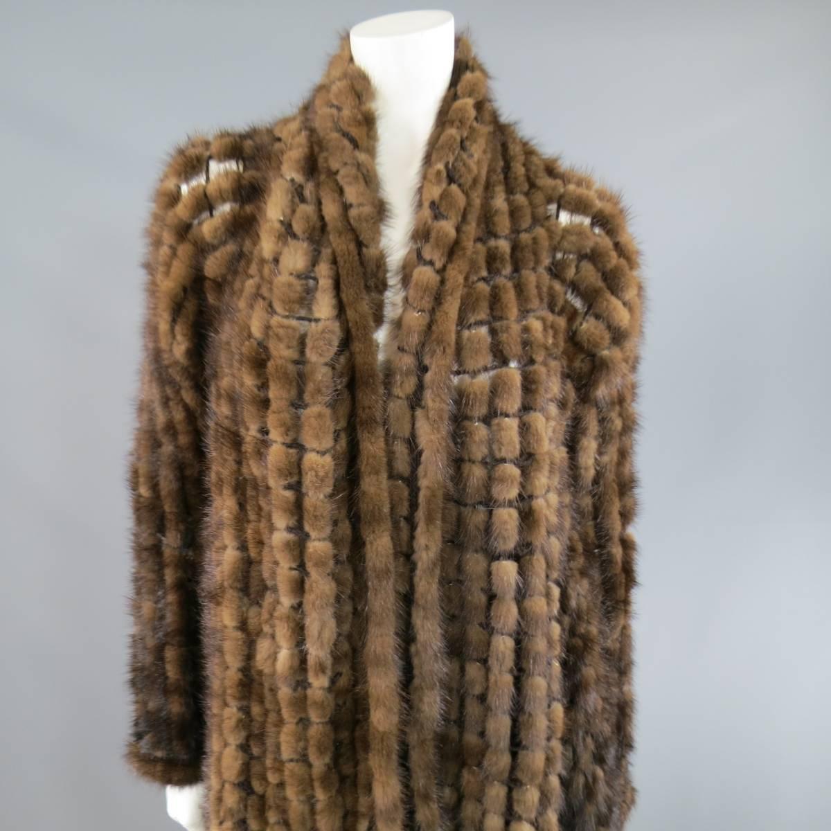 This fabulous ADRIENNE LANDAU fur cardigan comes in a large scale fishnet mesh with mink fur woven in throughout and features an extended long shawl collar, open front, and cropped back.
 
Excellent Pre-Owned Condition.
One Size.
