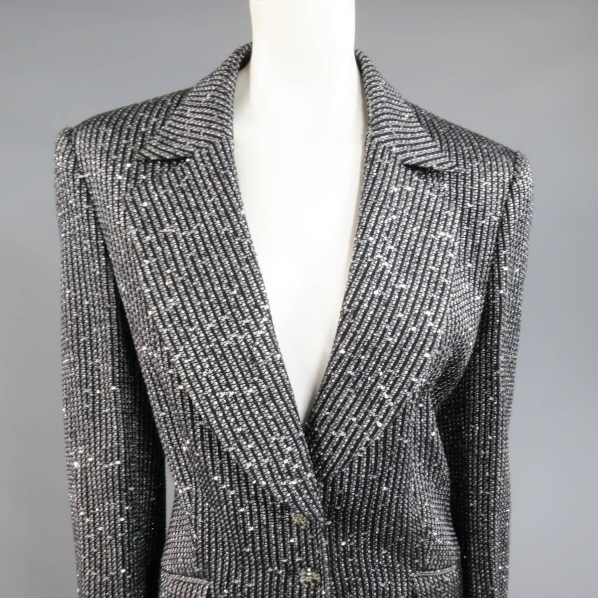 This gorgeous ESACADA sport coat jacket comes in a unique black and silver metallic striped Boucle with silver sequin woven in throughout and features a wide notch lapel, single breasted three button closure with glitter gray scale tortoise 
