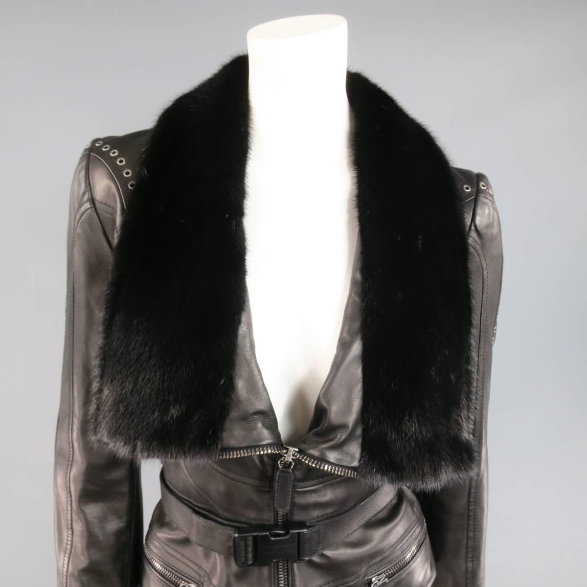 This fabulous EMANUEL UNGARO cropped biker jacket comes in a buttery soft black leather and features a long black mink fur collar lapel, zip up front, double zip pockets, decorative seam details, optional leather buckle belt, and grommet