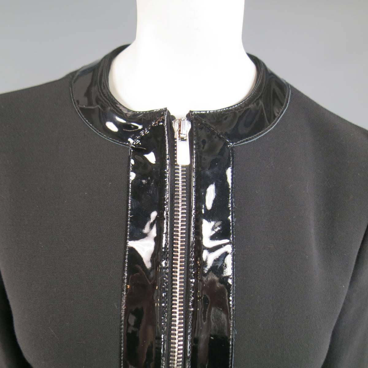 This gorgeous MICHAEL KORS jacket comes in black virgin wool and features a crew neckline, double engraved, silver tone zip closure, double zip pockets, and thick, glossy patent leather piping. Made in Italy.
Retails at $1995.00.
 
Excellent