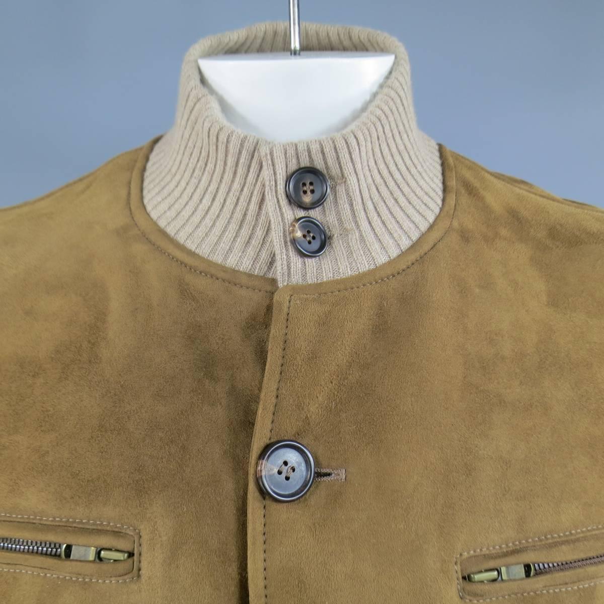 Classic BRUNELLO CUCINELLI bomber jacket in tan sudede shearling featinga button up front, high, ribbed collar, zip  pockets, and beige ribbed bands. Made in Italy.
Retails at $5800.00 .

New with Tags.
Marked Size: XL
 
Measurements:
