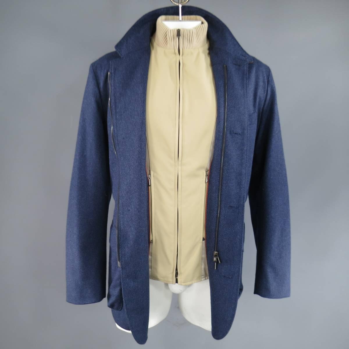 This classic LORO PIANA coat comes in a dark blue stripe textured cashmere an features a high collar neck with button tab and brown suede lining, button up and zip closure, double patch flap pockets, plaid Strom System liner, and detachable zip off