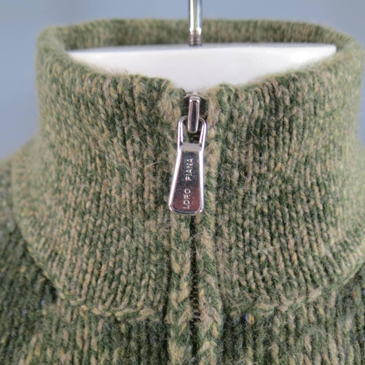 LORO PIANA Sweater consists of 100% cashmere material in a green color tone. Designed with a high-collar, half zip-up front in silver hardware. Detailed with multi-green argyle pattern. Solid sleeves and back section. Comes with original tags.