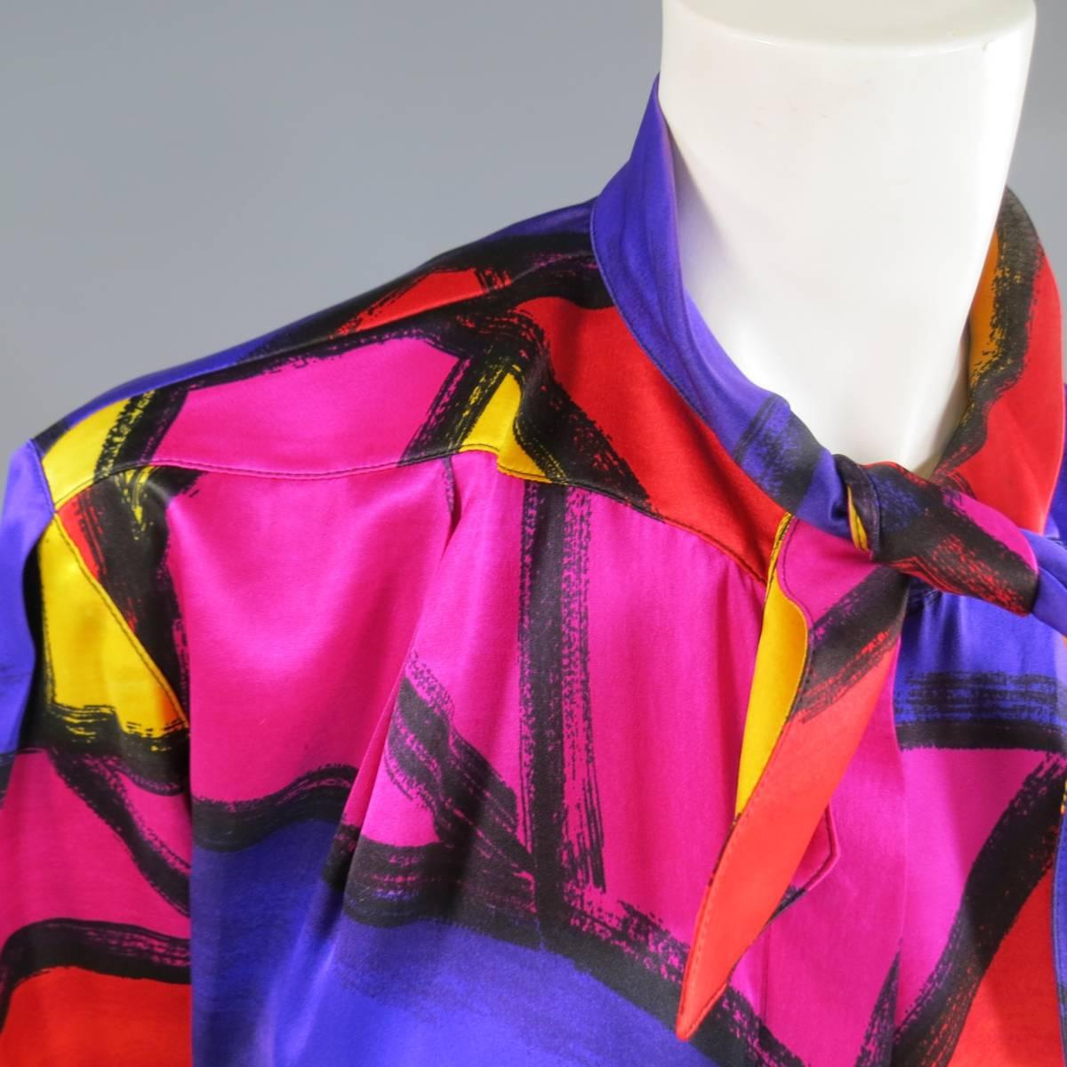 This fabulous vintage 1980's THIERRY MUGLER blouse comes in a vibrant multi color abstract brush stroke art print silk and features a hidden placket snap closure and tied collar. Some discoloration on collar. As-Is. Made in France.
 
Good
