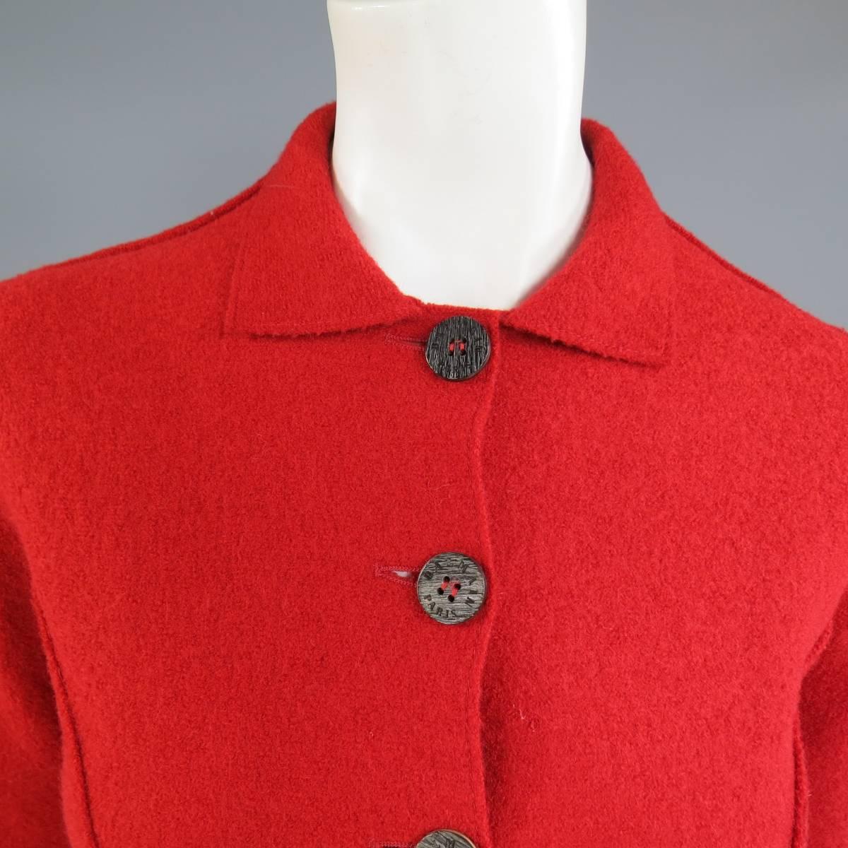 This rare vintage BALMAIN soft shoulder jacket comes in a soft red wool textured felt and features a tailored silhouette, reverse seam bust darts, cuffed sleeves, engraved wooden buttons, pointed collar.  Made in Italy.
 
Excellent Pre-Owned