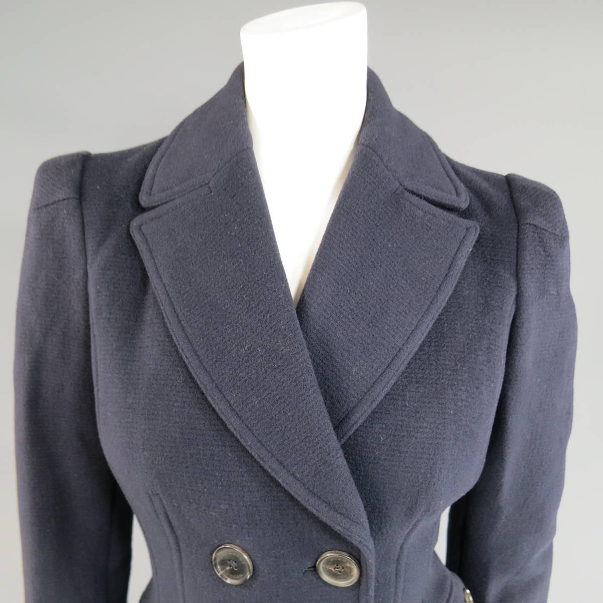 This gorgeous BURBERRY LONDON long peacoat comes in a navy bluye virgin wool blend and features a pointed lapel, double breasted button up closure, structured hourglass silhouette, pleated shoulder sleeves, double button pockets, and back belt