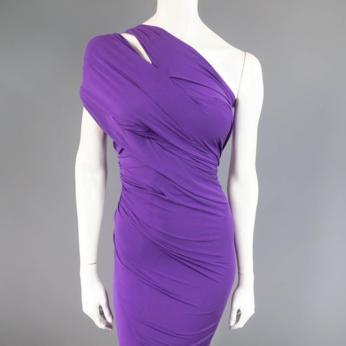 This fabulous DONNA KARAN cocktail dress comes in a brilliant orchid purple stretch silk jersey and features a one shoulder neckline with slit, fitted bodycon silhouette, and ruched mid section construction. Fully lined. Color is a true orchid