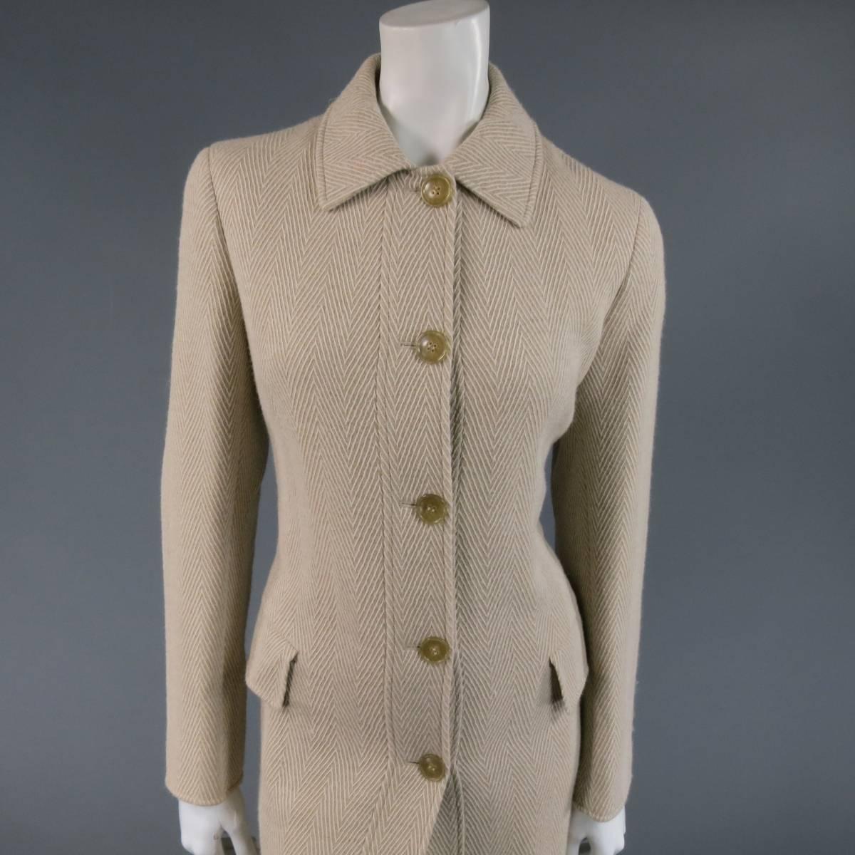 Classic LUCIANO BARBERA coat in light beige and cream Herringbone Chevron print textured alpaca with a pointed collar, five button closure, back vent, and double flap pockets. Made in Italy.
 
Excellent Pre-Owned Condition.
Marked Size: 42 IT
