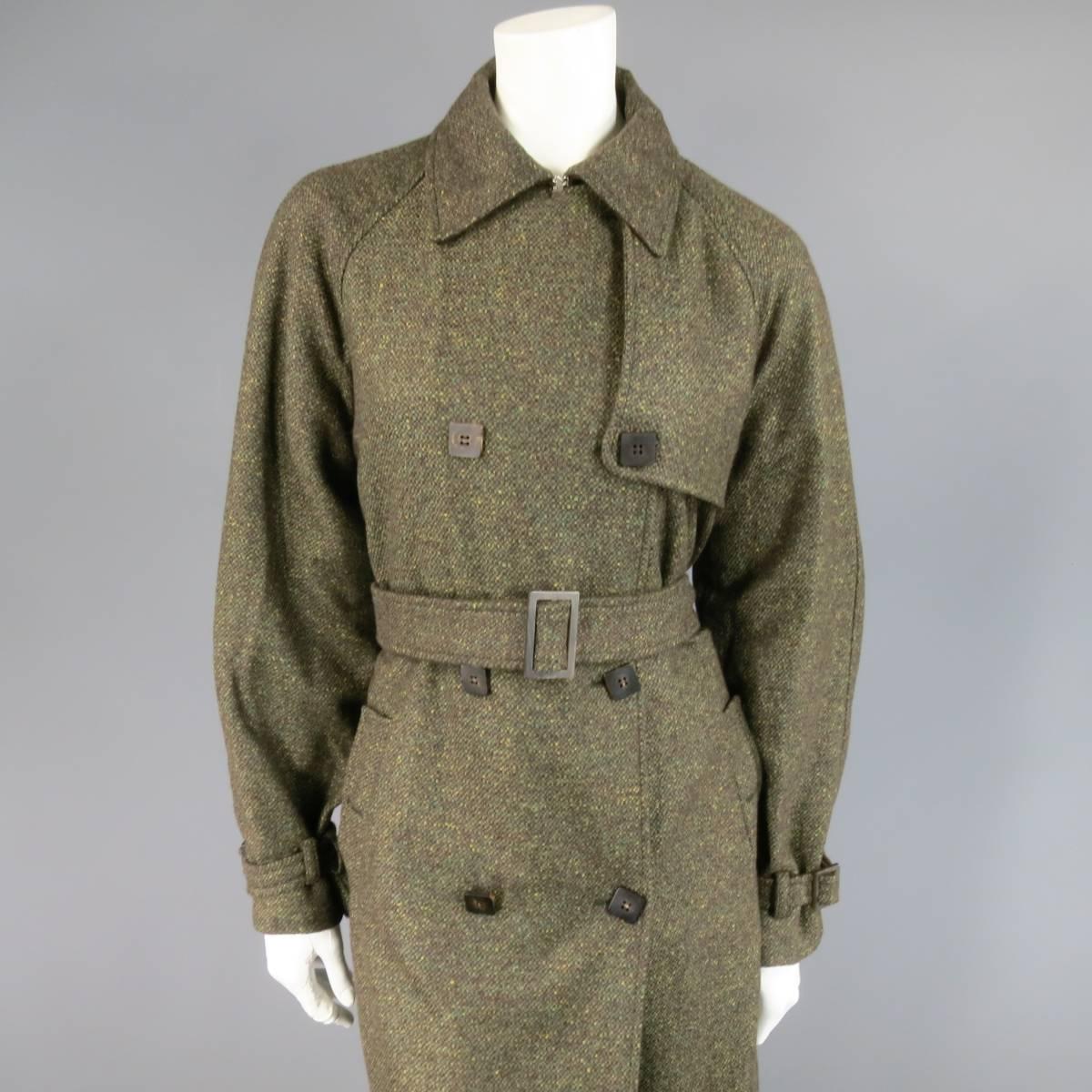 This gorgeous LORO PIANA winter trench coat comes in a brown and olive green Eart tone tweed and features a classic collar lapel, raglan sleeves with belts, double breasted button up closure, storm flap, double button slit pockets, belted waist, and