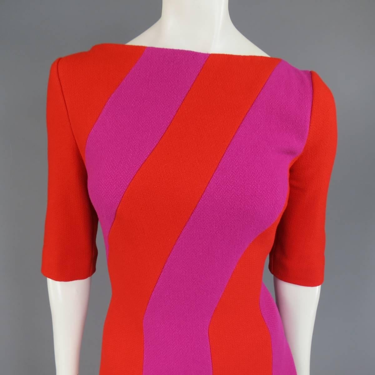 This fabulous TALBOT RUNOF winter dress comes in a vibrant red and magenta color block striped virgin wool blend fabric and features a scoop neck, three quarter sleeves, and a line skirt. Made in Germany.
 
Excellent Pre-Owned Ocndition.
Marked: