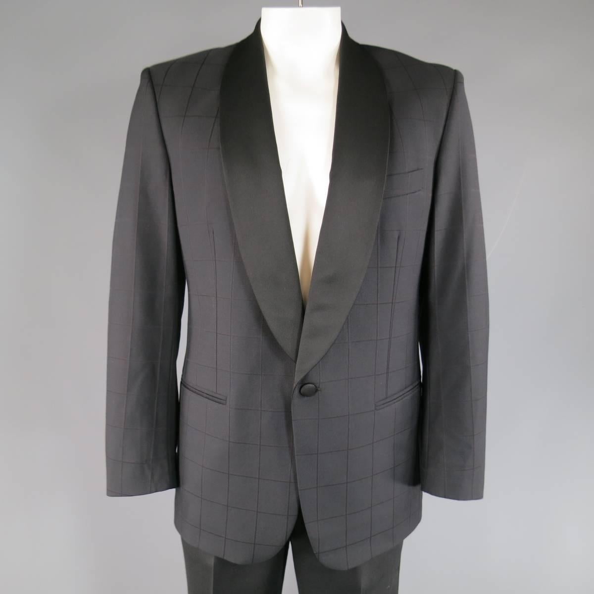 Vintage MISSONI UOMO tuxedo in black windowpane print wool with accents of red & gray includes a single button dinner jacket with black satin shawl collar and solid black pleated tuxedo stripe trousers. Made in Italy.
 
Excellent Pre-Owned