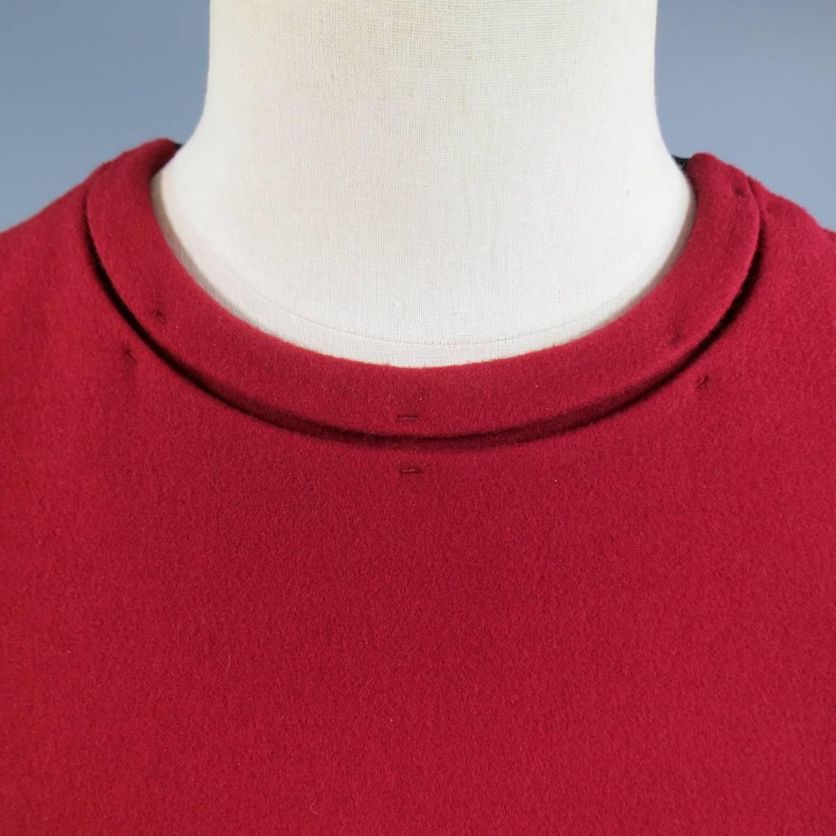 Chic JIL SANDER by Raf Simons vest shirt featuring a burgundy red wool blend felt front panel with top stitch sliced crew neck panel and black stretch back. Made in Italy. Retails at $1020.00.
 
Excellent Pre-Owned Condition.
Marked: M
