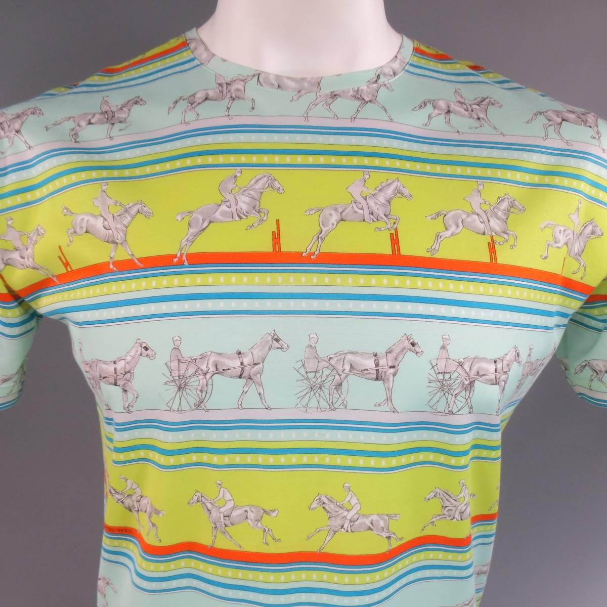 Vintage HERMES short sleeve T-shirt in light weight, semi sheer cotton with all over horse rider "Sequences" print featuring gray horses, light blue, lime green and teal stripes with Hermes signature orange details. Made in Italy.
