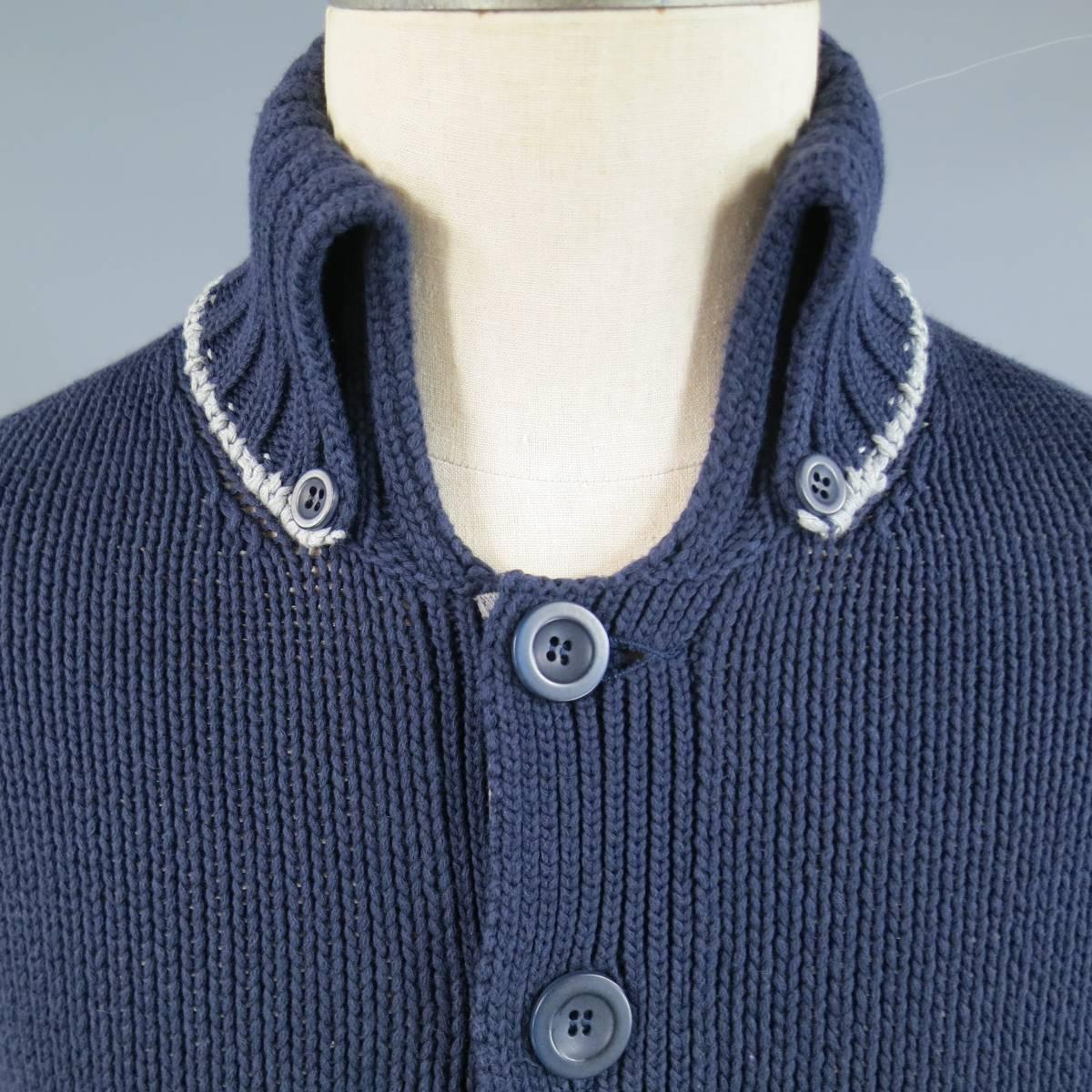 Unique BRUNELO CUCINELLI cardigan in a navy cotton blend medium weight navy blue knit with a button up silver gray lined closure, patch pockets, and a high ribbed button down collar with silver trim. Made in Italy.
 
Excellent Pre-Owned