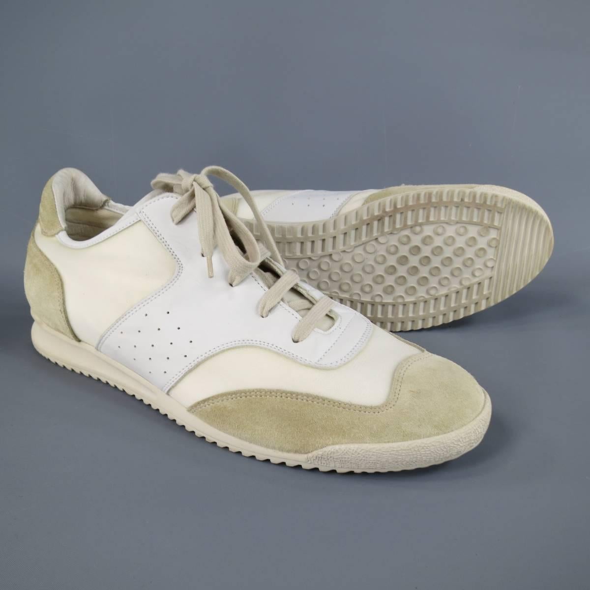 Unique MAISON MARTIN MARGIELA sneakers in a creamy beige textured canvas with beige sued and off white smooth leather panels, with a classic khaki sole. Made in Italy.
 
Excellent Pre-Owned Condition.
Marked: IT 46
 
Insole: 12.25 X 4 in.