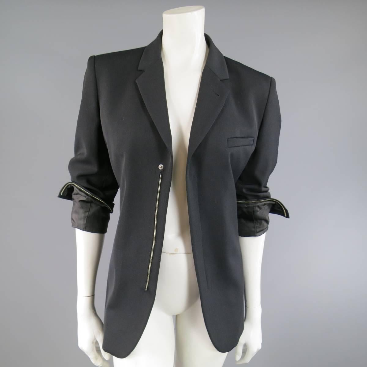 This Jean Paul Gaultier jacket comes in a wool blend twill with a notch lapel, hidden placket snap and zip closure, and internal zip hemmed slit cuffs. Made in Italy.
 
Excellent Pre-Owned Condition.
Marked: US 8
 
Measurements:
 
Shoulder: 16.5