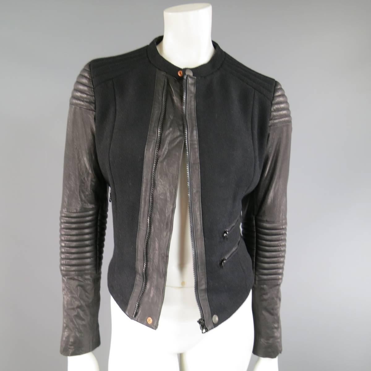 Fashion biker jacket by PAUL SMITH in a black wool blend with band snap collar, triple zip pockets, quilted shoulders, and padded leather sleeves.
 
Excellent Pre-Owned Condition.
No Marked Size.
 
Measurements:
 
Shoulder: 15.5 in.
Bust: 38