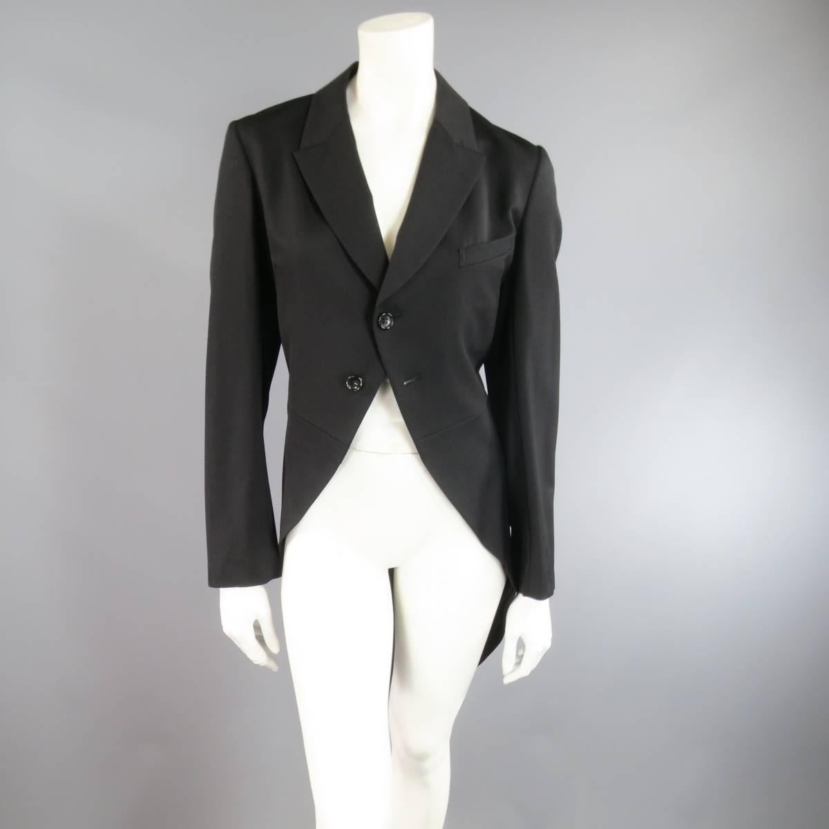 This gorgeous COMME DES GARCONS casual tuxedo inspired jacket comes in a light weight black wool twill and features a small peak lapel, two button closure, and high low coat tails hem. Made in Japan. Retails at $1285.00.
 
Brand New With