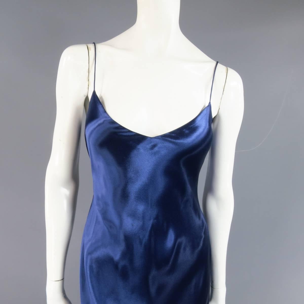 This lovely RALPH LAUREN COLLECTION slip dress comes in a stunning glossy navy blue silk satin and features a v neckline, skinny spaghetti straps, and fitted A line silhouette. Made in Italy.
 
Good Pre-Owned Condition.
No Size Tag.
