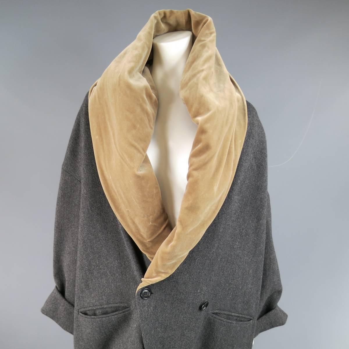 This chic vintage ROMEO GIGLI oversized cacoon coat comes in a gray herringbone wool blend and features a two button double breasted closure, drop shoulder cuffed sleeves, and deep V neckline with tan velvet shawl collar. Some wear on velvet. Made