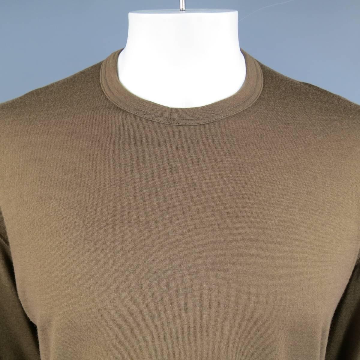 Vintage COMME DES GARCONS HOMME PLUS pullover sweater in a soft, light brown, wool jersey featuring a classic crewneck, and thick band hems. Circa 1995. Made in Japan.
 
Excellent Pre-Owned Condition.
Marked: L (AD 1995)
 
Measurements:
