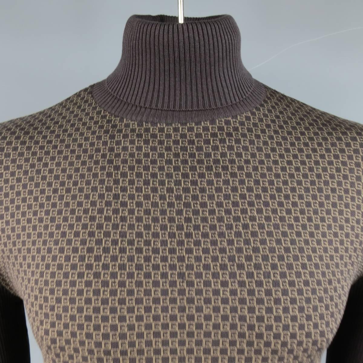 Chocolate brown ribbed silk knit turtleneck by GUCCI featuring a G tan monogram print frontal panel. Made in Italy.
 
Excellent Pre-Owned Condition.
Marked: L
 
Measurements:
 
Shoulder: 19 in.
Chest: 44 in.
Sleeve: 27 in.
Length: 25 in.