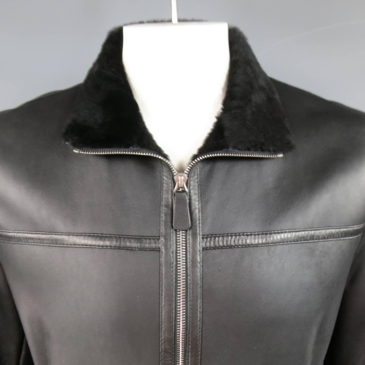 ORME IN PORTOFINO winter jacket in smooth black lamb leather with ultra soft fur shearling lining featuring a silver tone zip front, snap pockets, and high neck. Made in Italy.
 
Excellent Pre-Owned Condition.
Marked: IT 52
 
Measurements:

