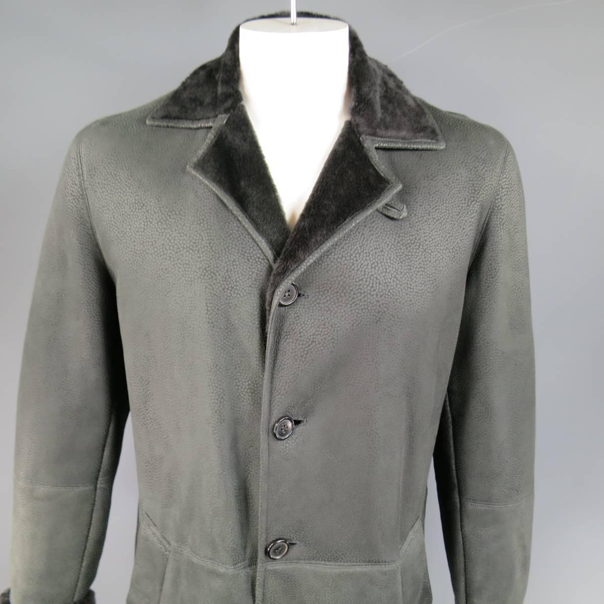 Classic SERAPHIN winter coat in soft black matte, spotted textured shearling leather with black fur lining, featuring a four button closure, pointed collar, and slanted pockets. Made in France.
Retails at $5500.00.
 
Excellent Pre-Owned